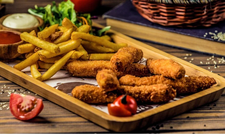 Kids Meal - Crispy chicken tenders with golden fries — a kid-friendly favorite served with dipping sauces.